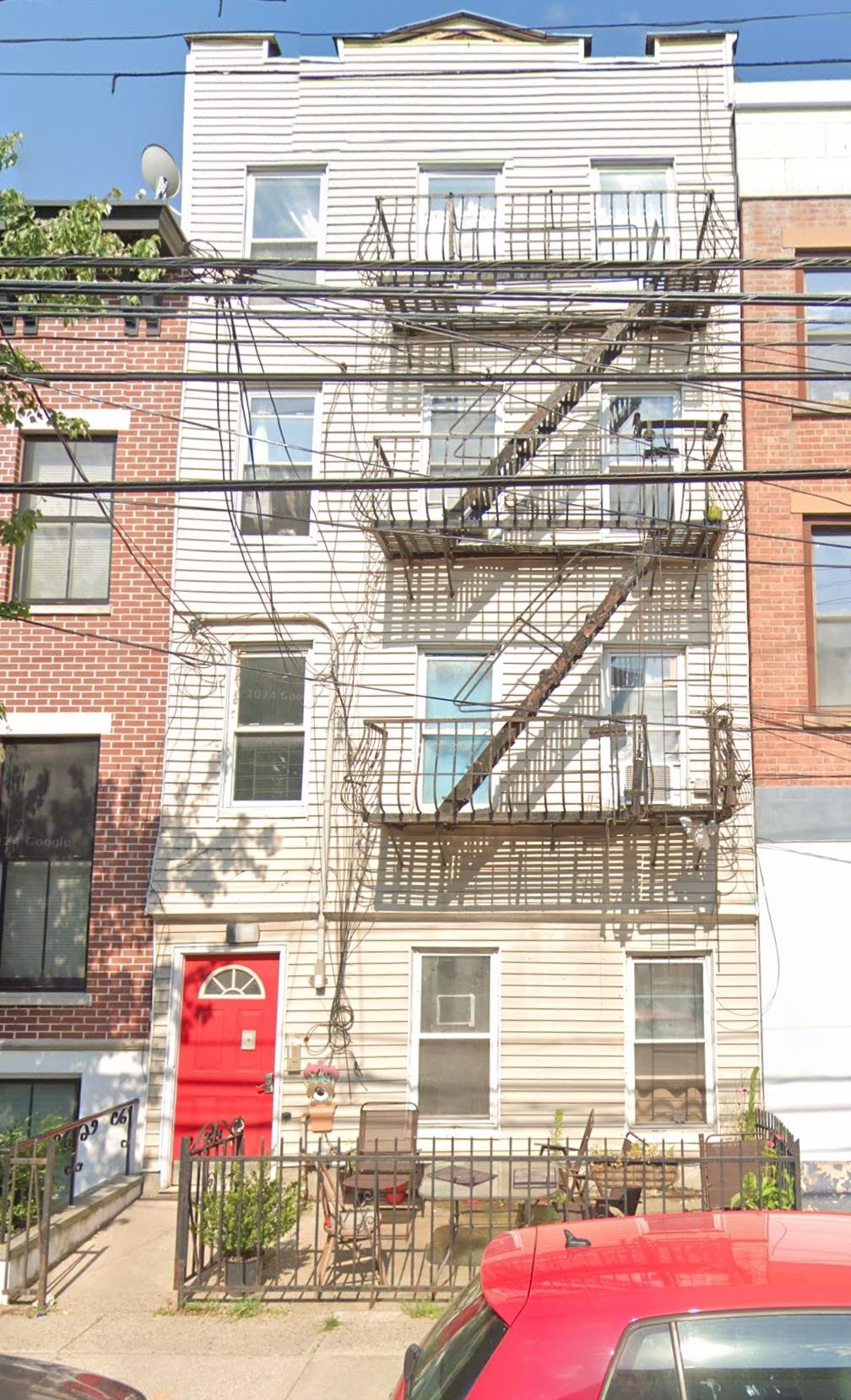 a view of a building with a street