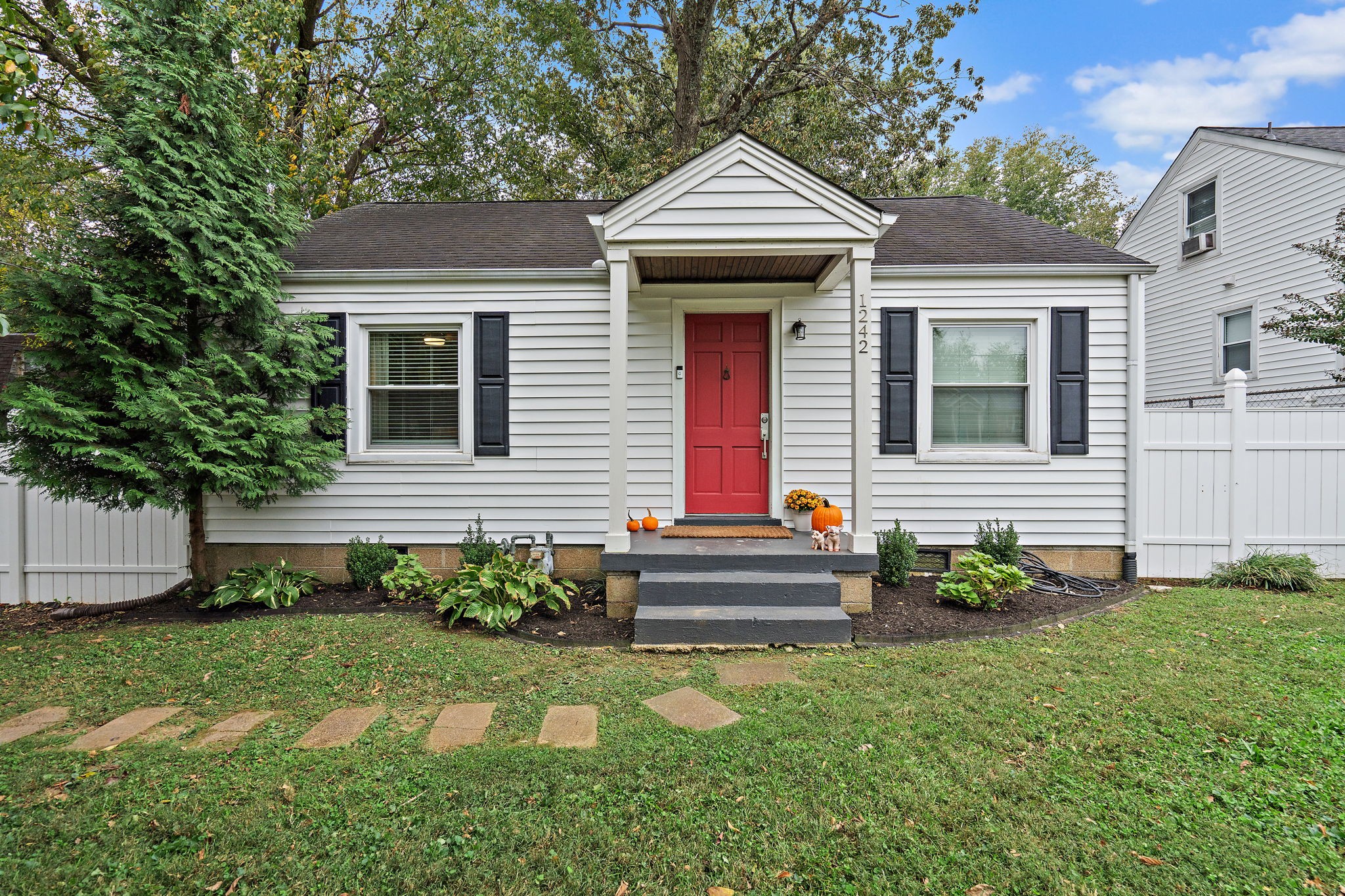 a front view of a house with garden