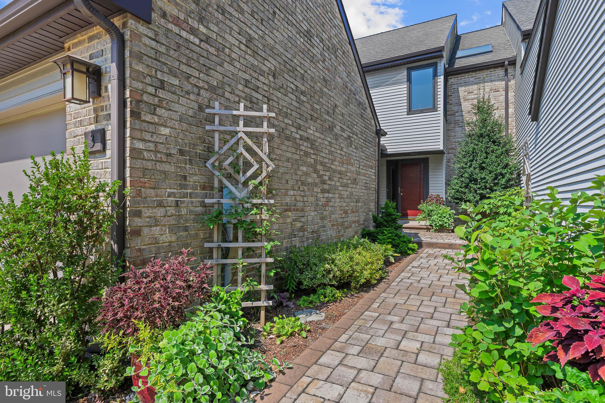 a view of house with flower pots