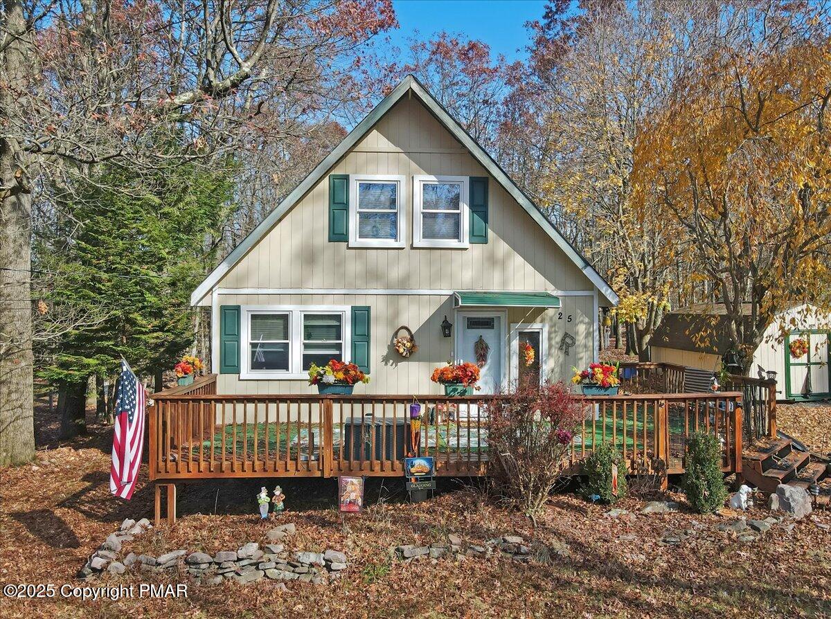 a front view of a house with deck yard and deck