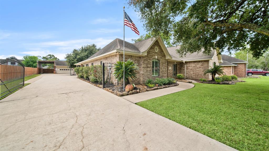 Beautiful curb appeal, long drive w/ security gate