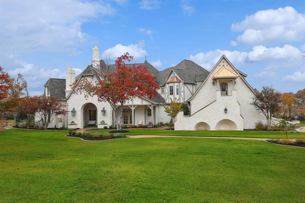 a front view of house with yard and green space