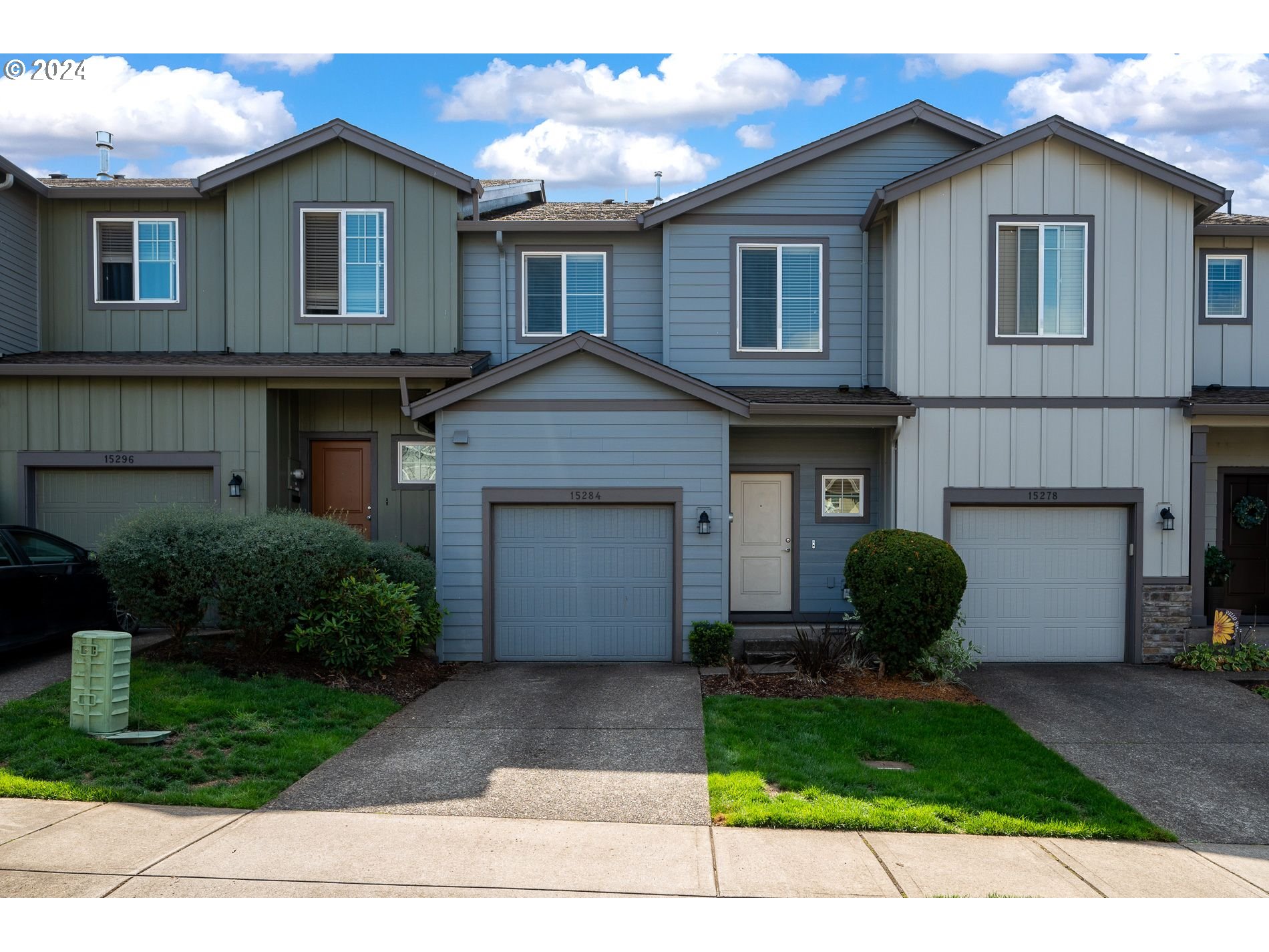 a view of a yard in front view of a house