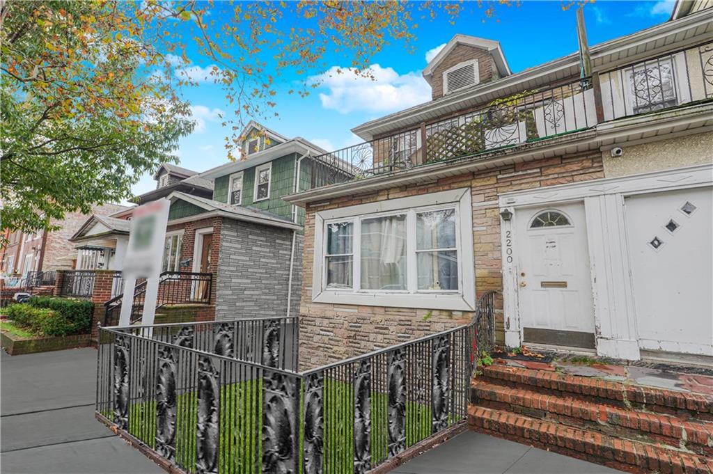 a front view of a house with stairs