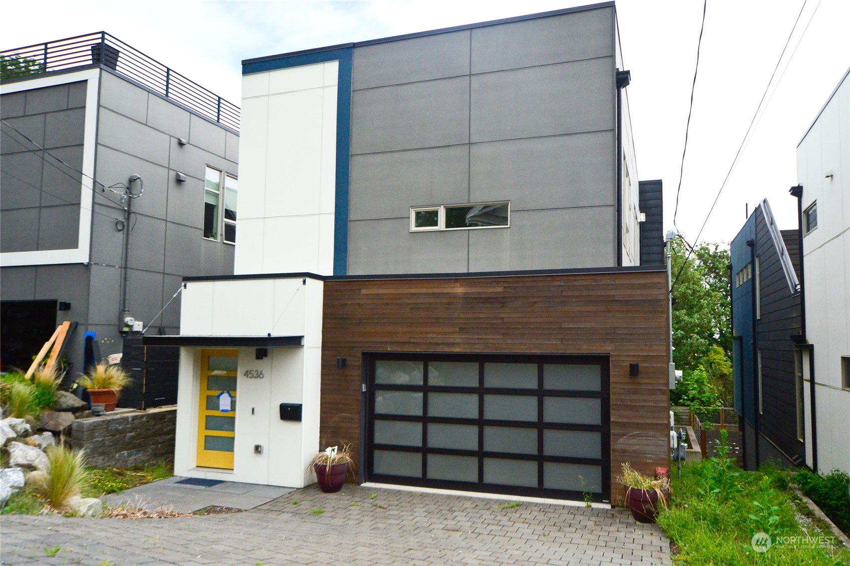 a front view of a house with a garage