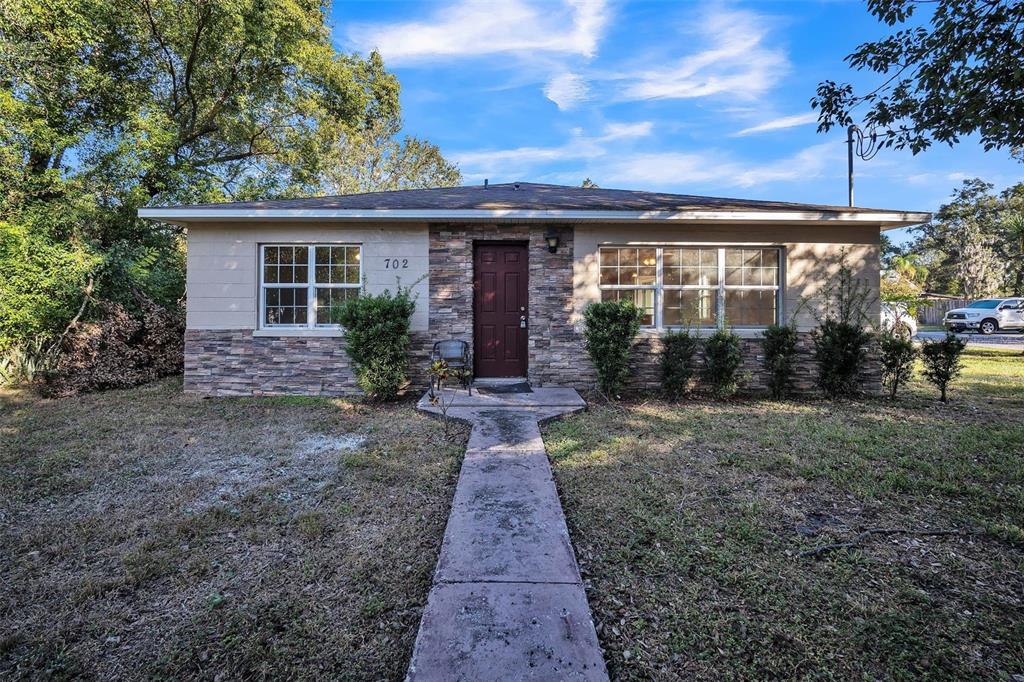 front view of a house with a yard