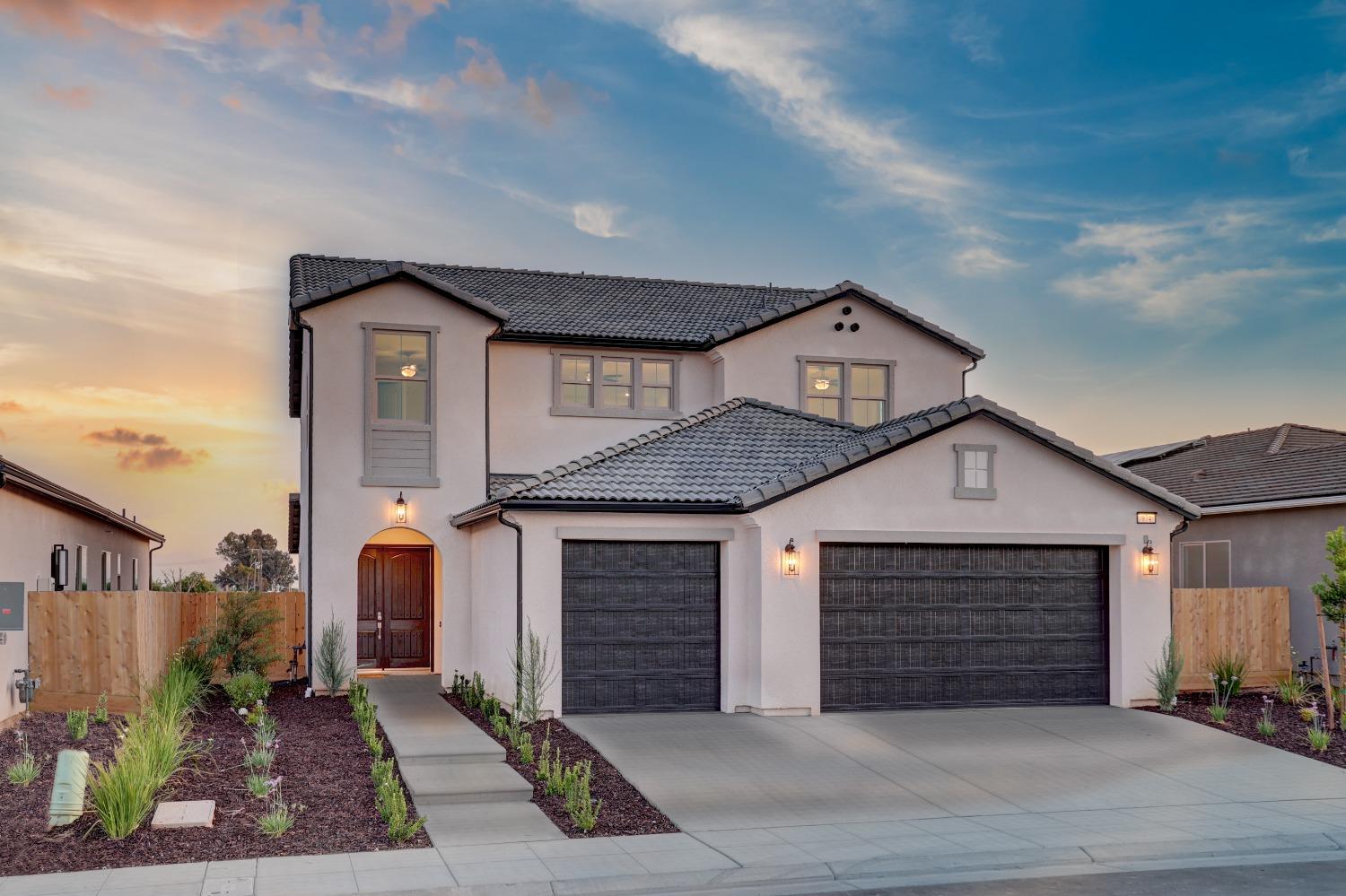 a front view of a house with a garage