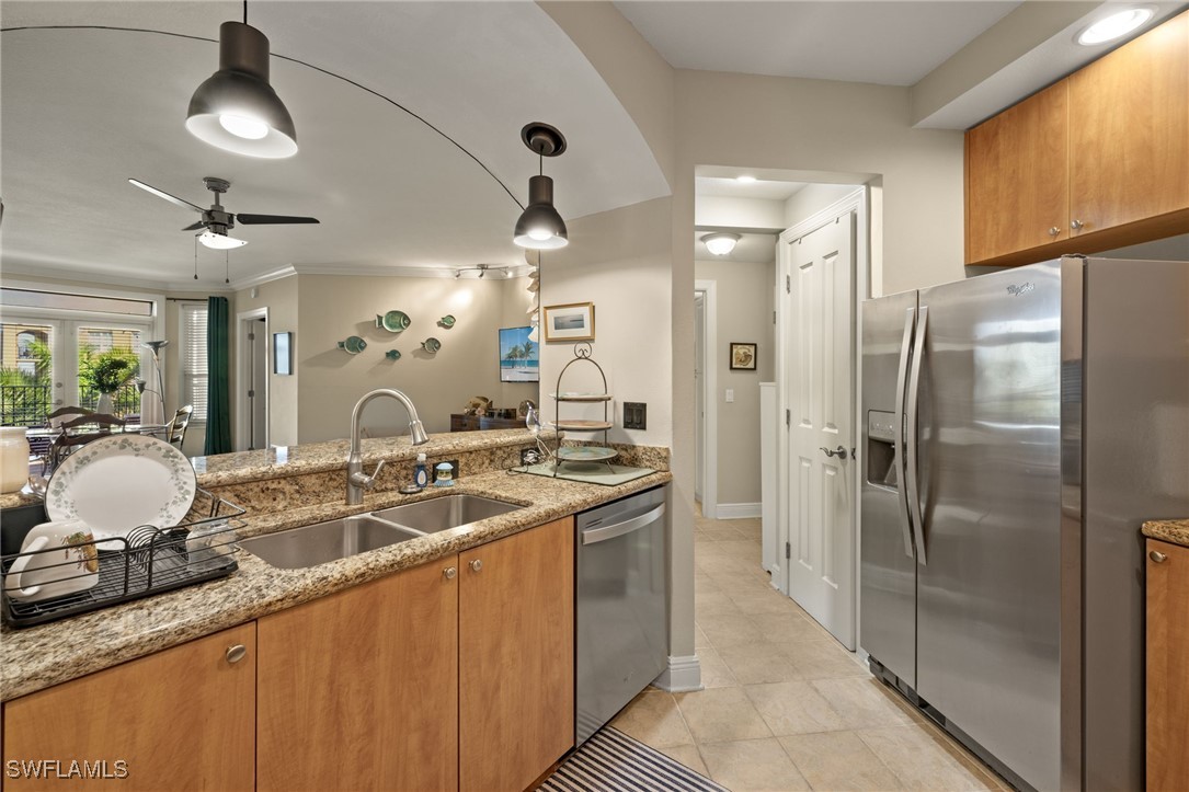 a bathroom with a granite countertop sink a mirror and shower