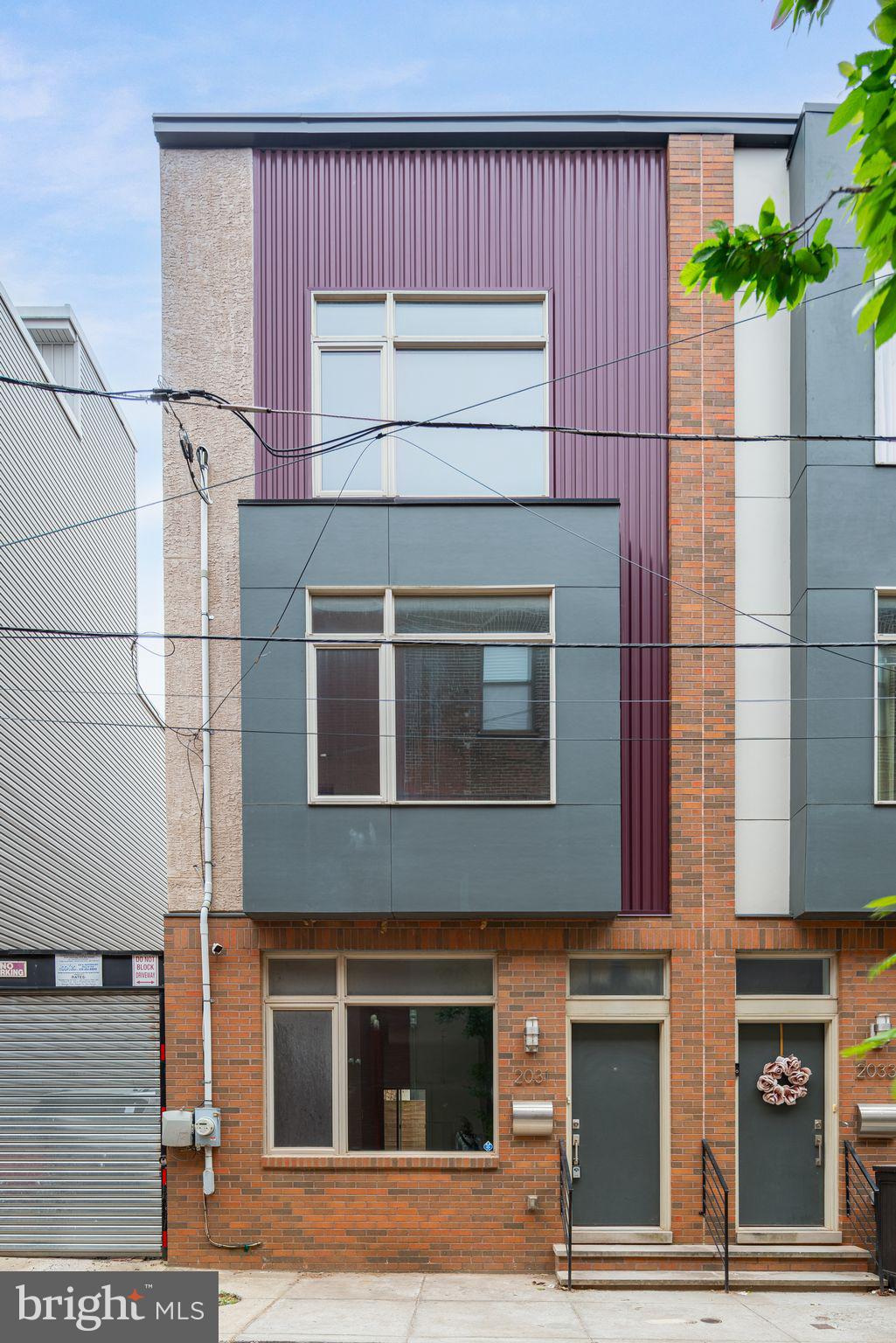 a front view of a house with garage