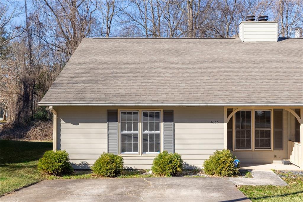 a front view of a house with a yard and a garage