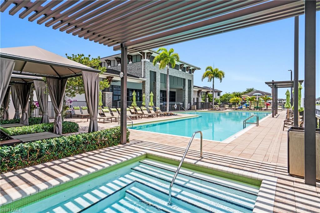 a swimming pool with patio outdoor seating and yard