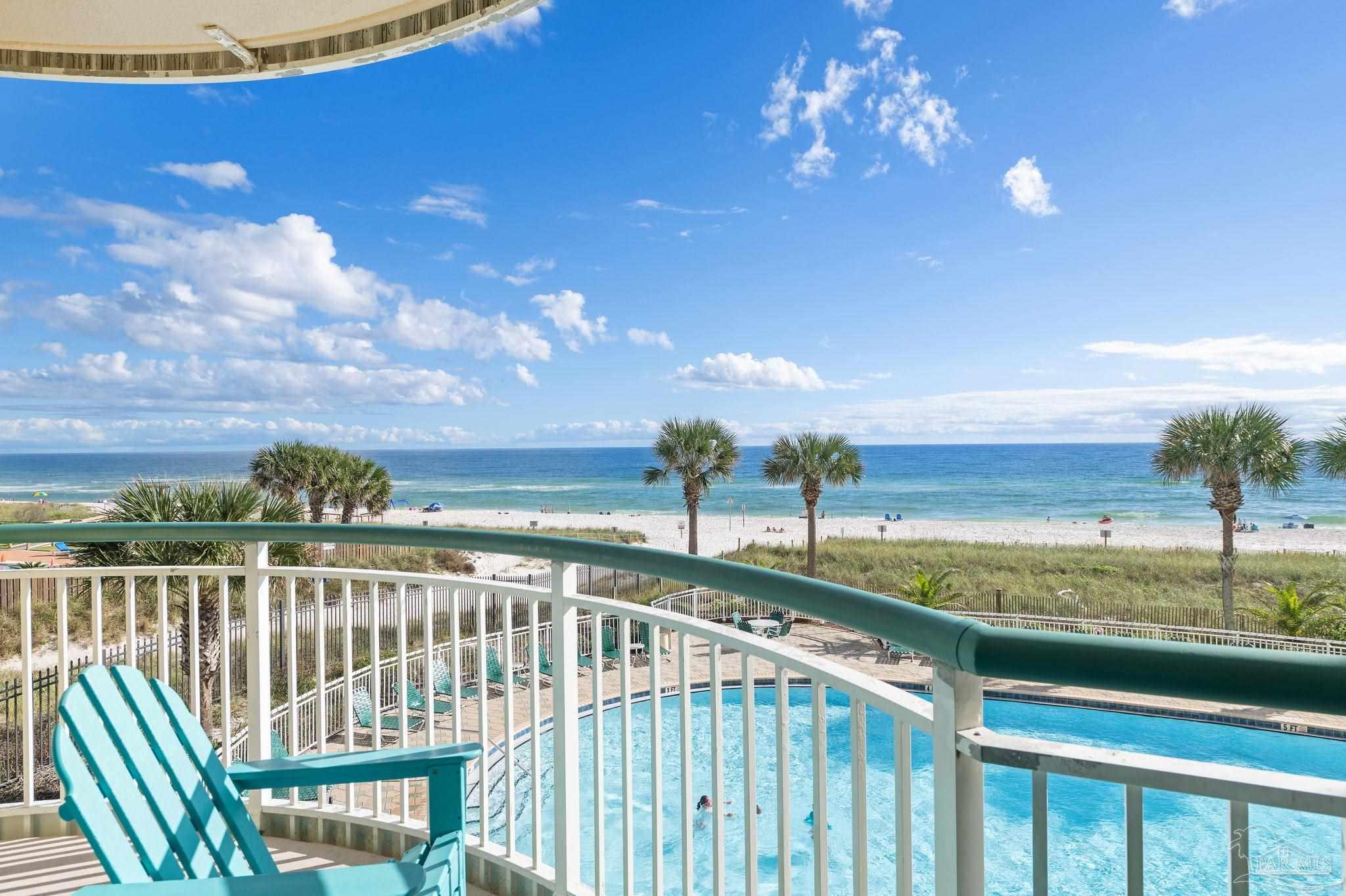 a view of a balcony with an ocean view