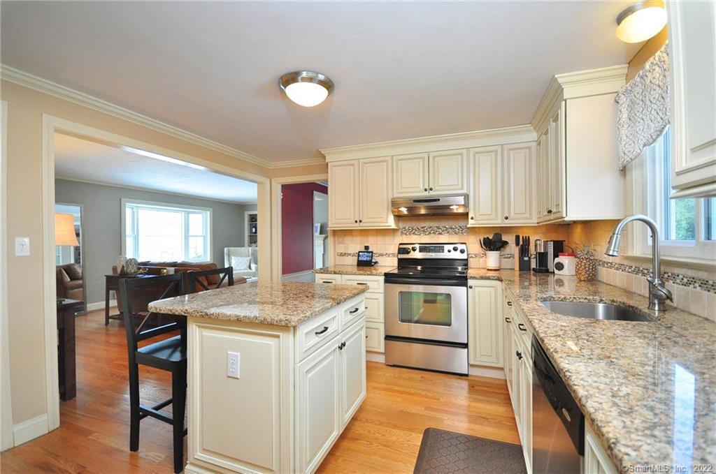 Update kitchen with granite and stainless steel. Open floor plan to the living room with fireplace