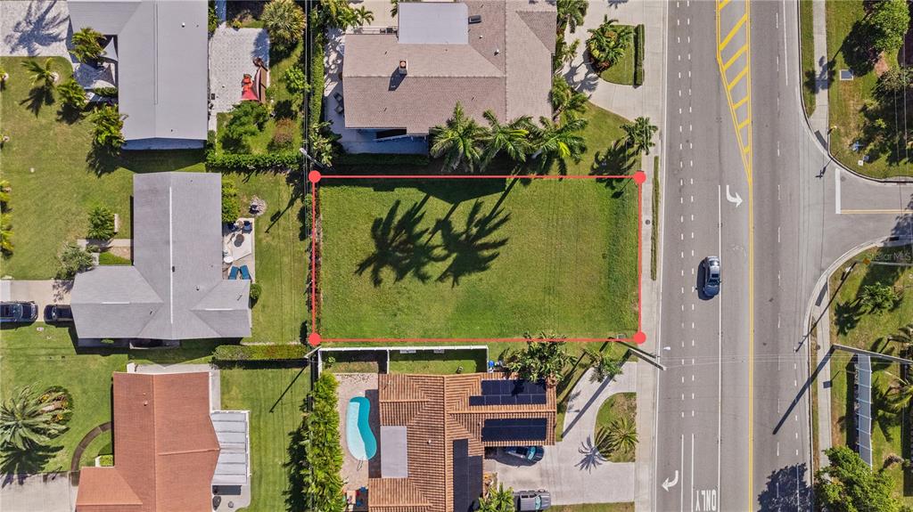 an aerial view of a house with a garden and swimming pool