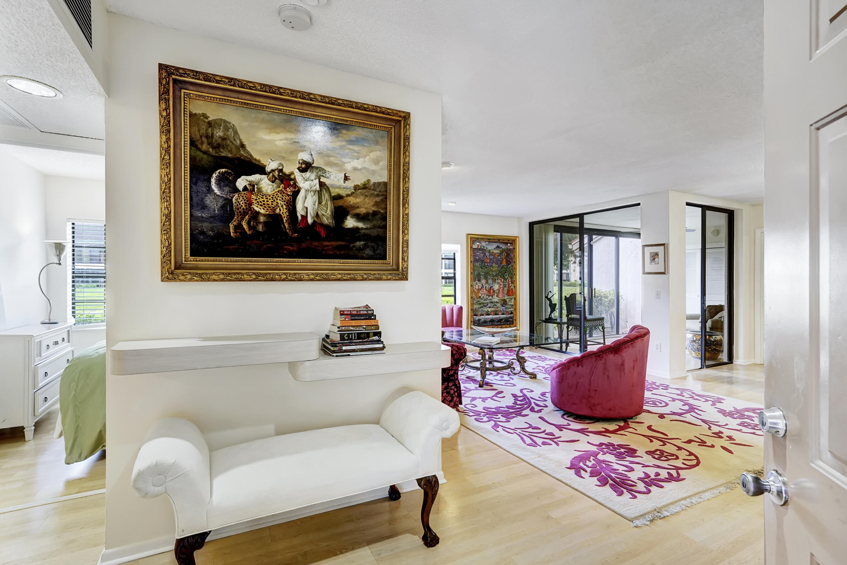 a living room with furniture and a potted plant