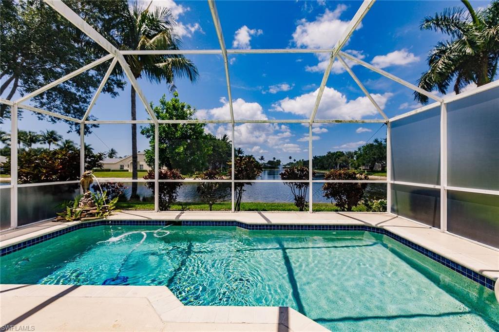 a view of a swimming pool with a patio