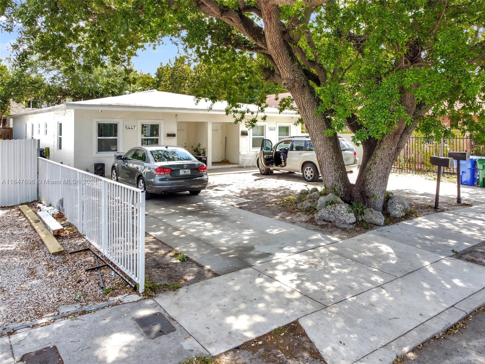 a view of a car park in front of a house