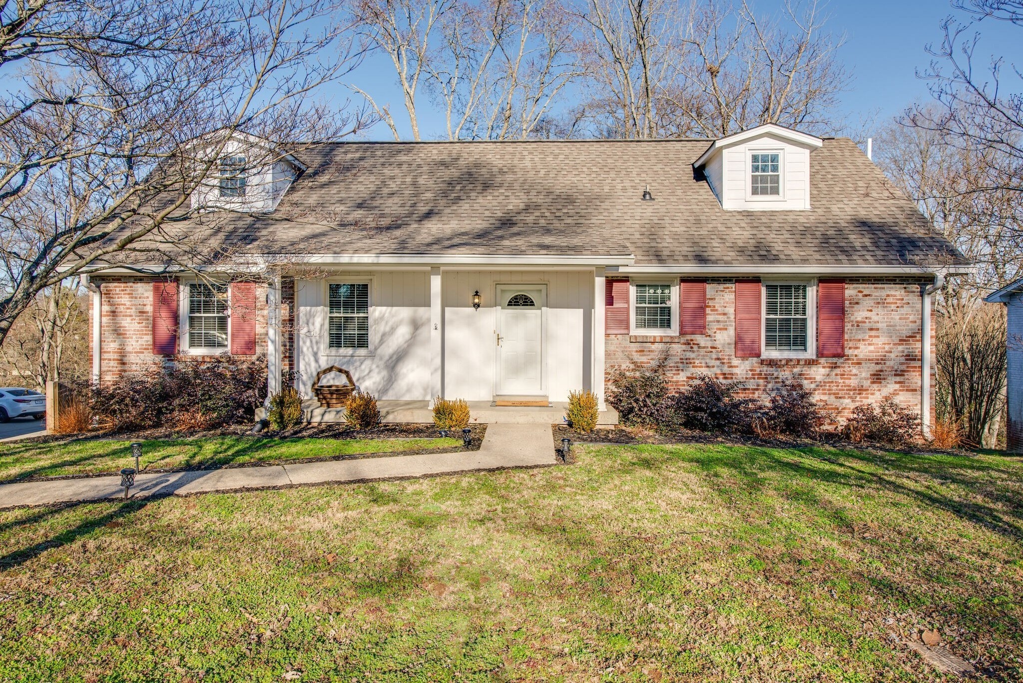 a front view of a house with a yard