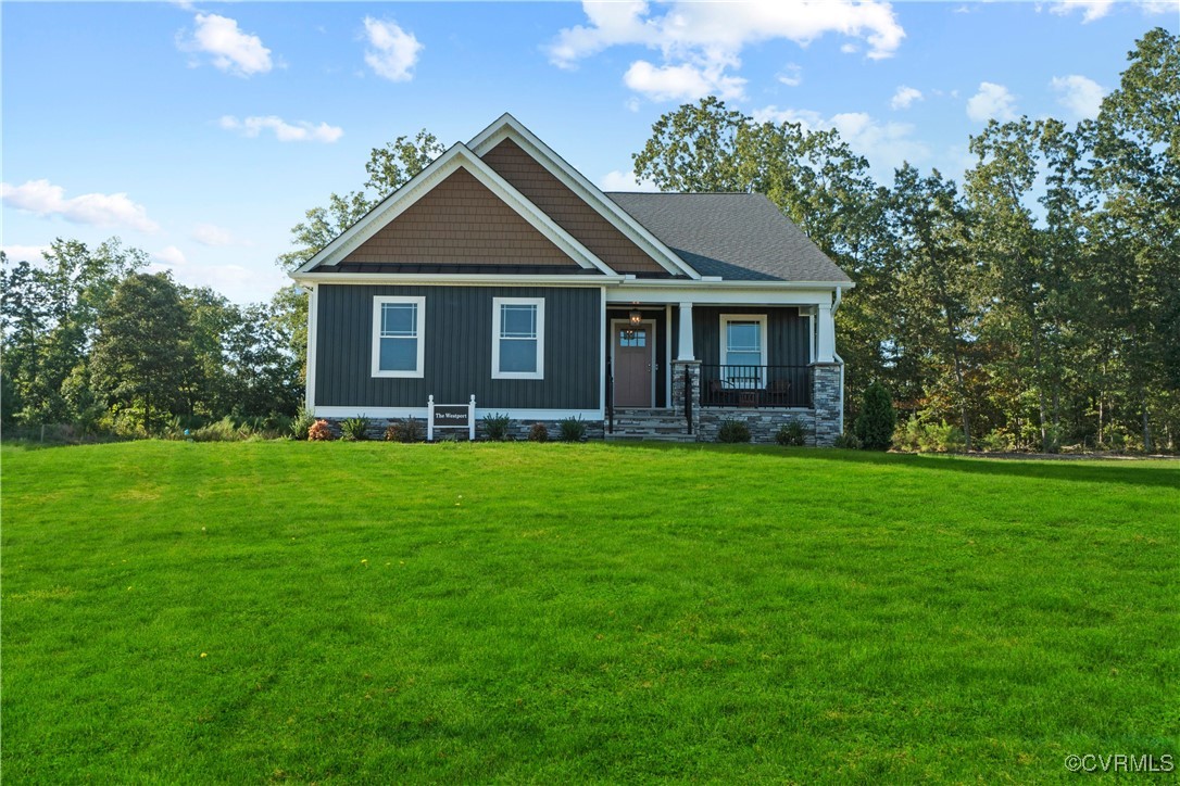 Craftsman-style home featuring covered porch and a