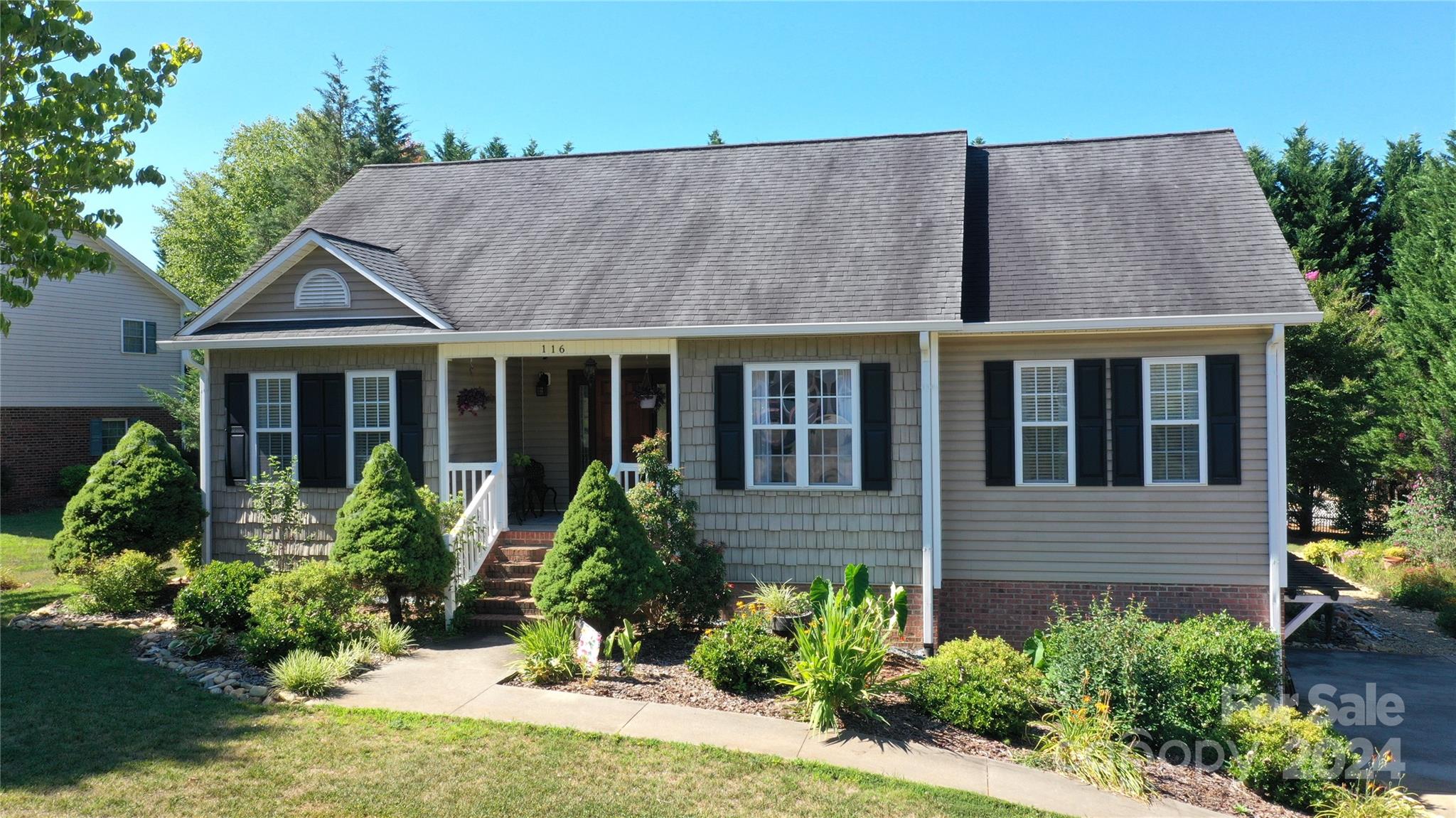 front view of a house with a yard