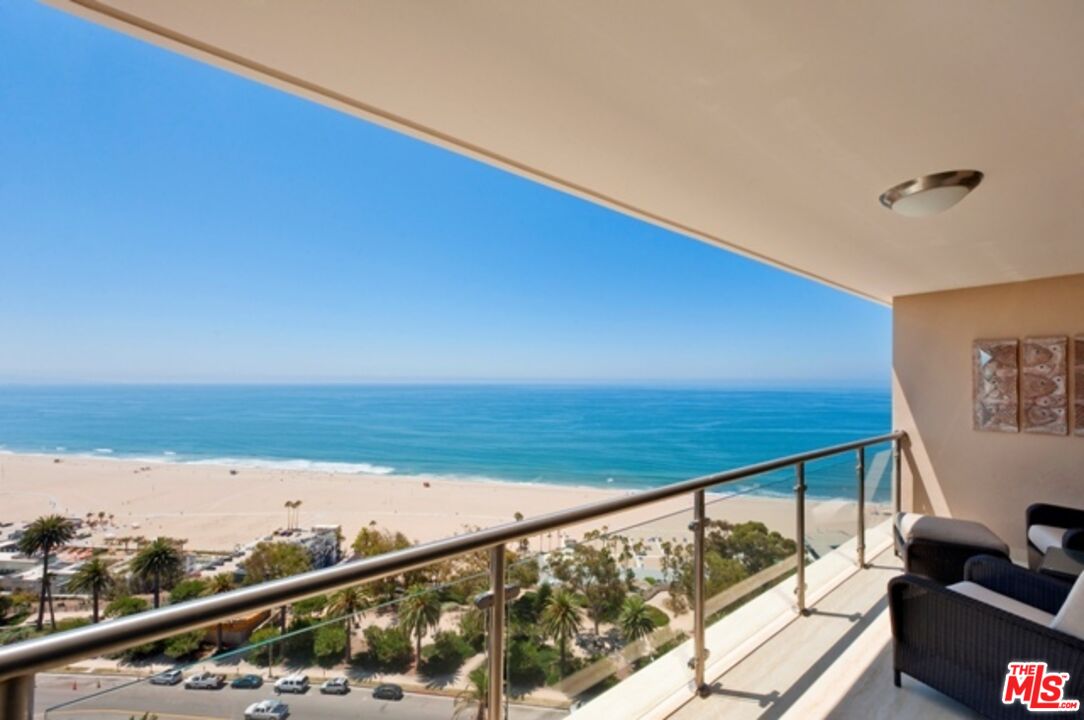 a view of balcony with furniture