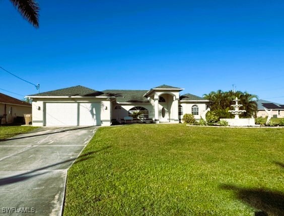 a front view of a house with a garden and yard