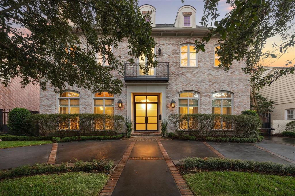 Situated on a 10,150 sq ft lot (per App Dist), this elegant River Oaks residence has great curb appeal with its impressively groomed landscaping, circular/gated driveway, classically designed brick facade with noteworthy covered double door entry balanced by flanking windows with arched transoms above and rooftop dormer windows.