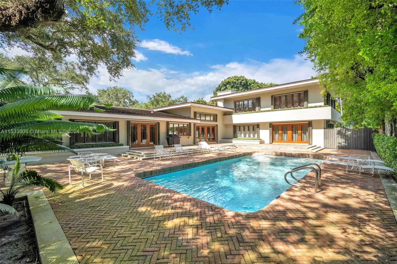 a front view of house with yard having outdoor seating