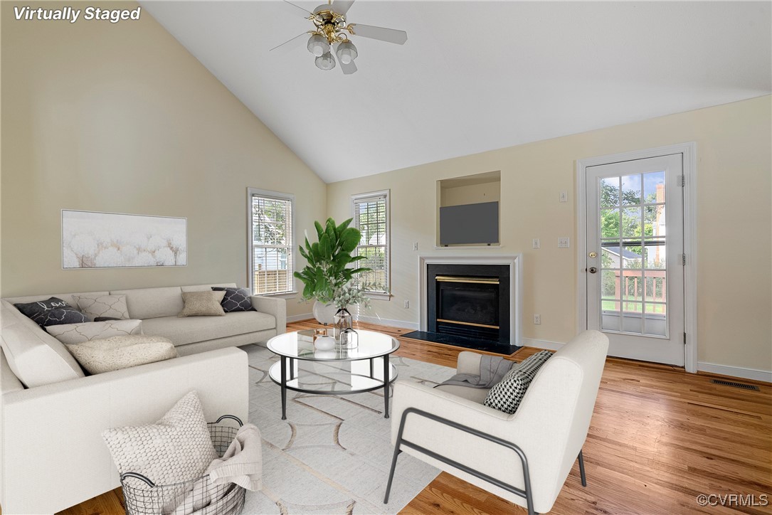 a living room with furniture and a fireplace