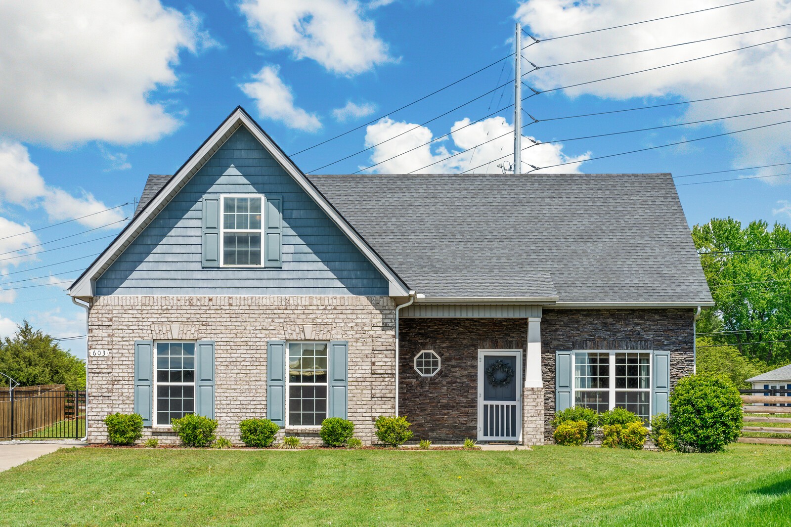 a front view of a house with garden