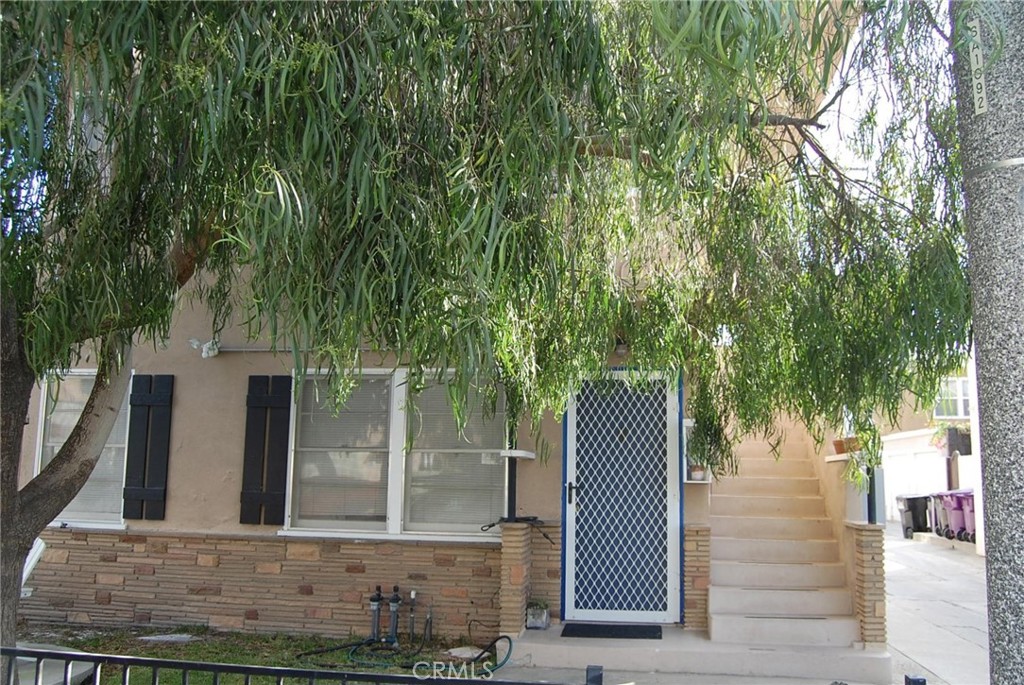 front view of a house with a garden