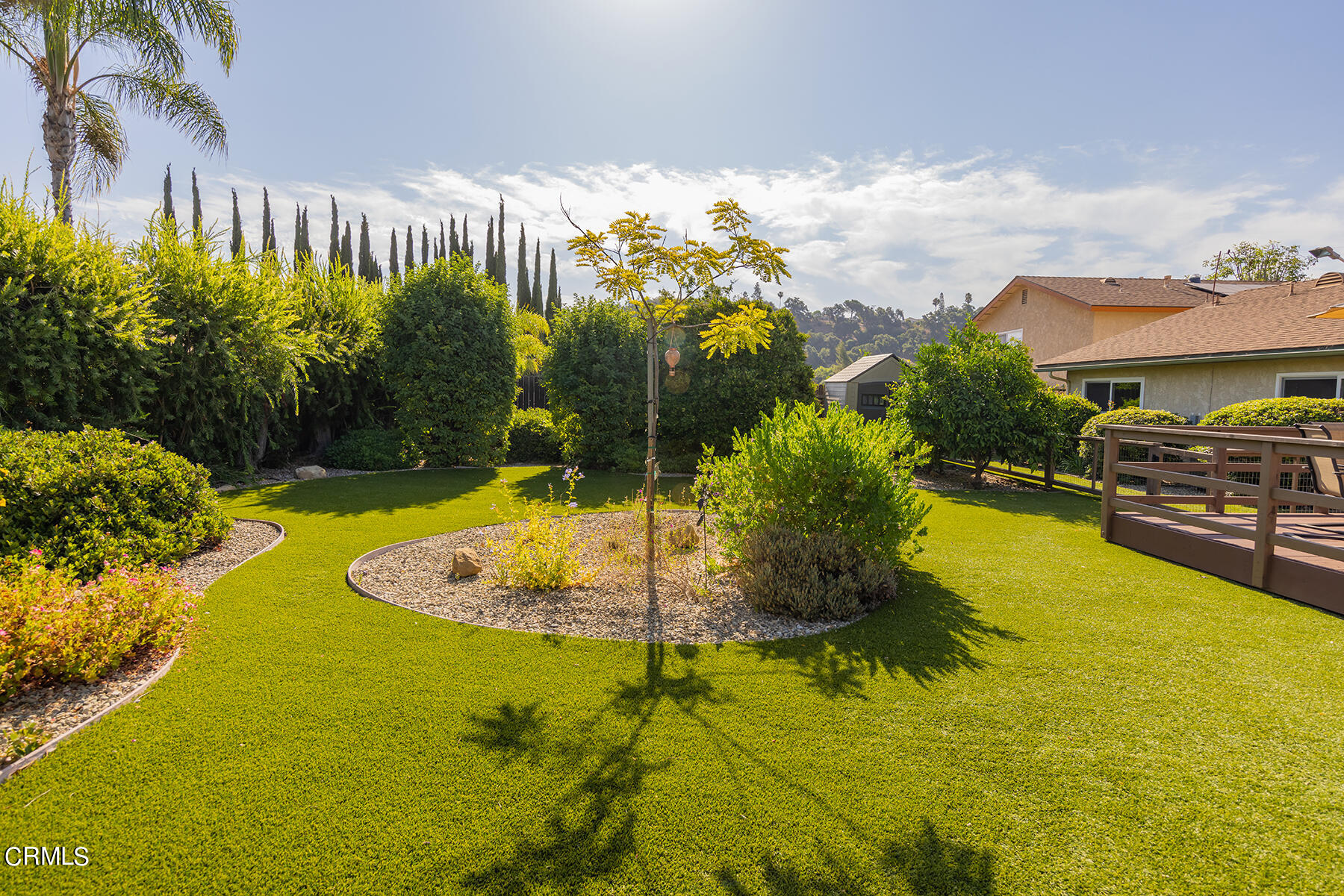 a swimming pool with trees in the background