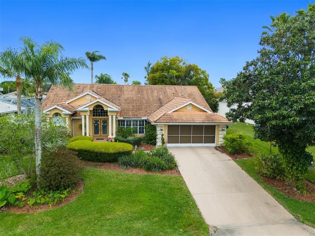 a front view of a house with garden