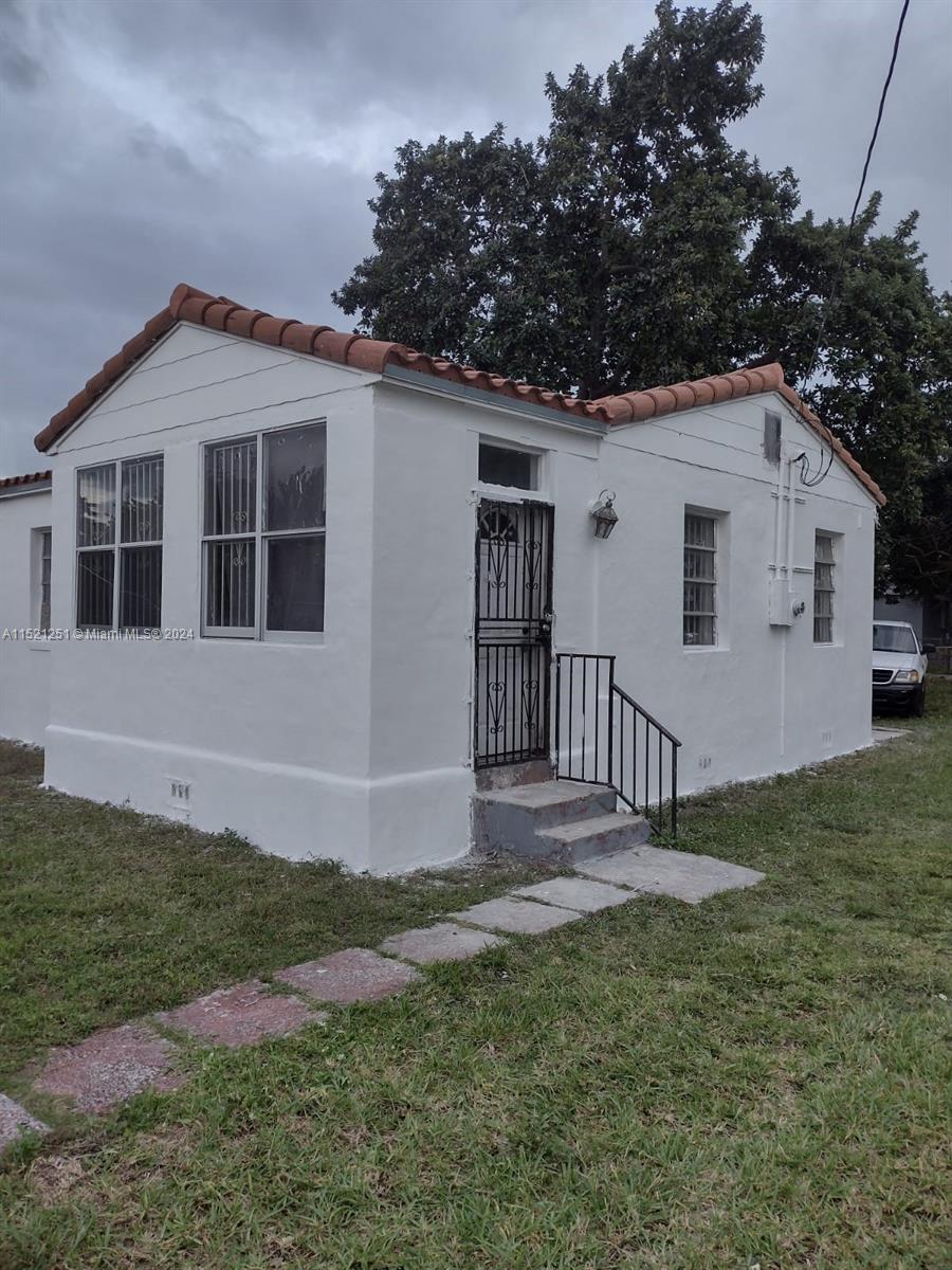 front view of a house with a yard