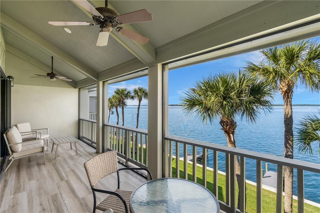 a view of a balcony with furniture