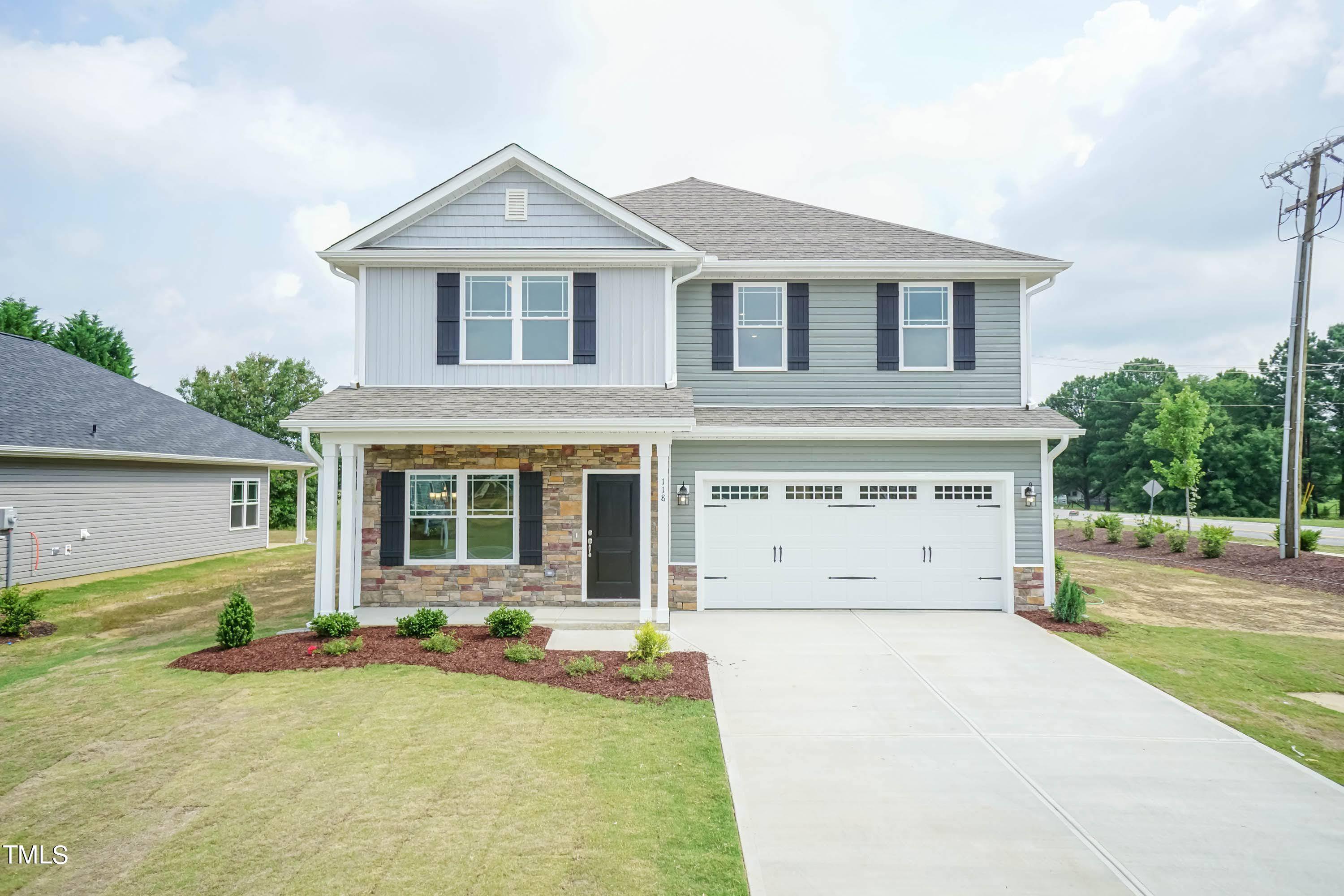 front view of a house with a yard