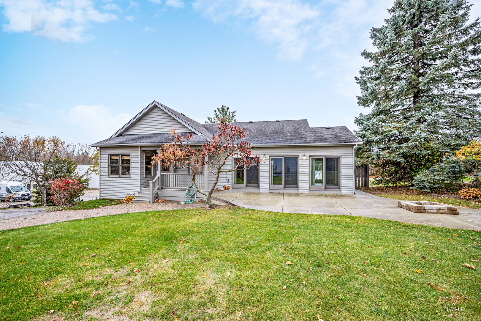 a front view of house with yard and outdoor seating