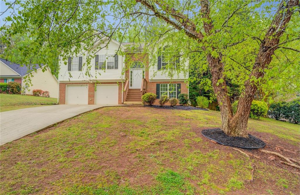 a front view of a house with a yard