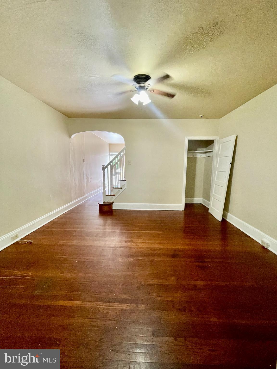 a view of a room with wooden floor