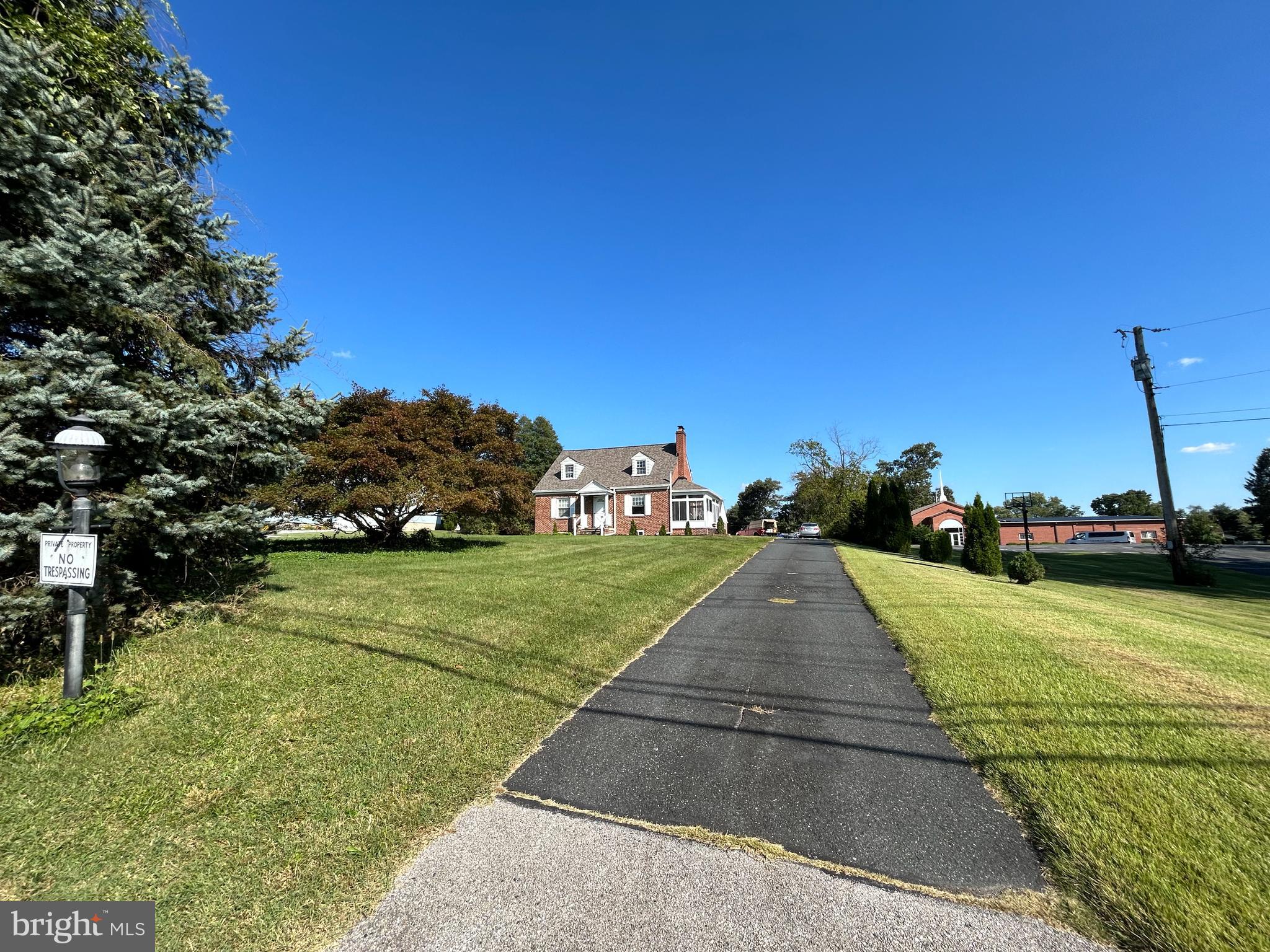 a view of a street both of side view of a house