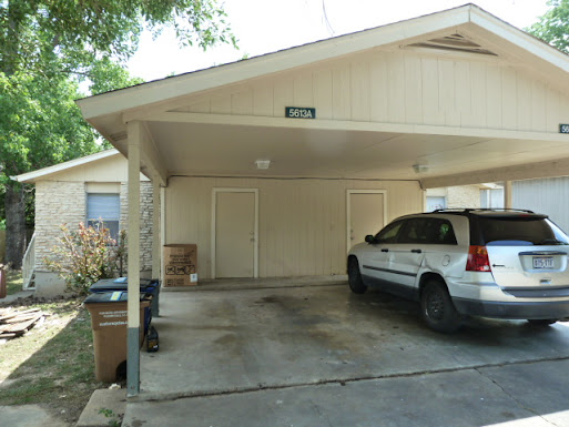 a car parked in front of a house