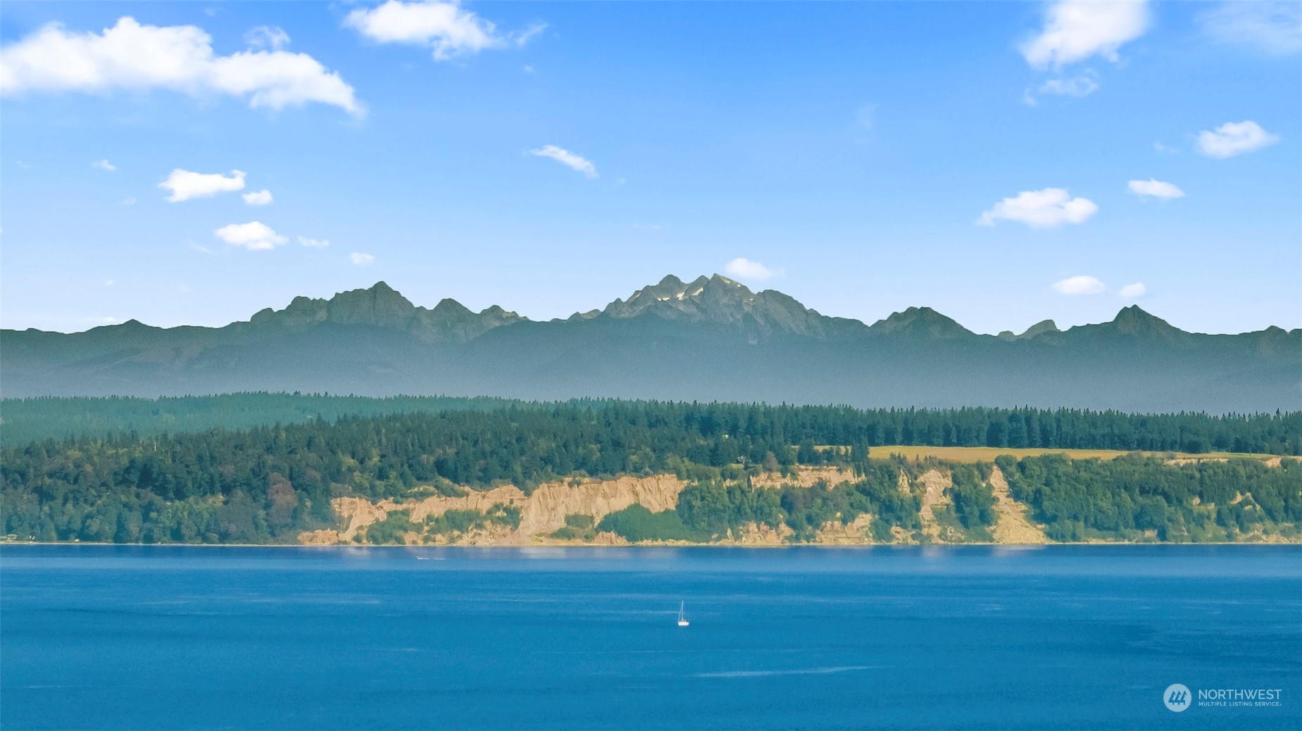 a view of lake with green space