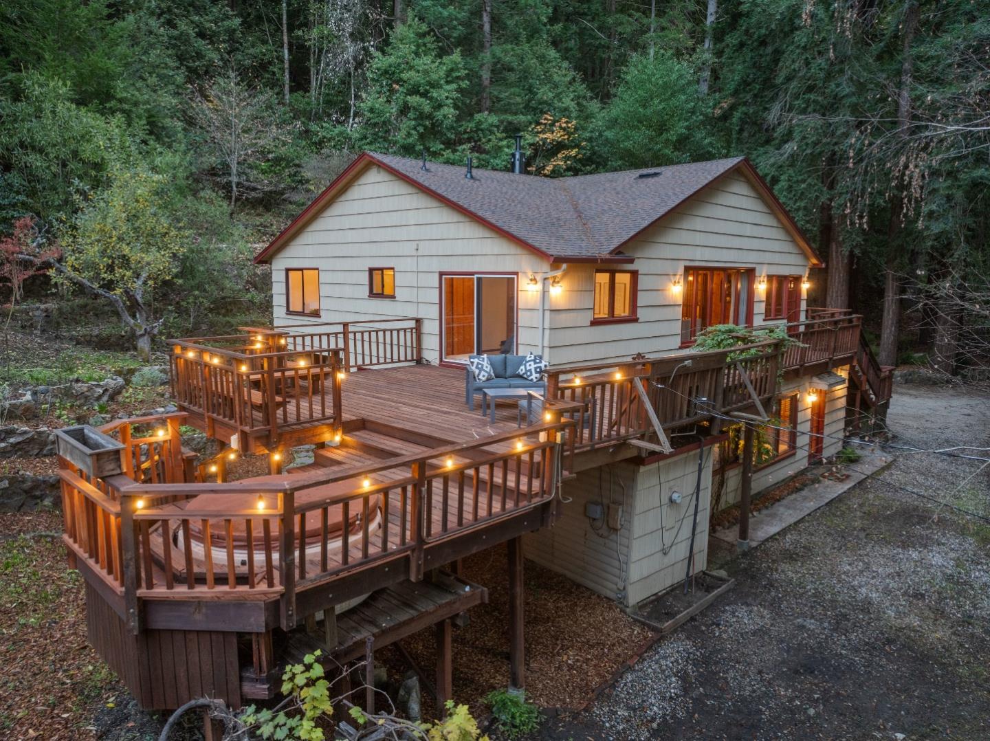 a view of a house with backyard and sitting area