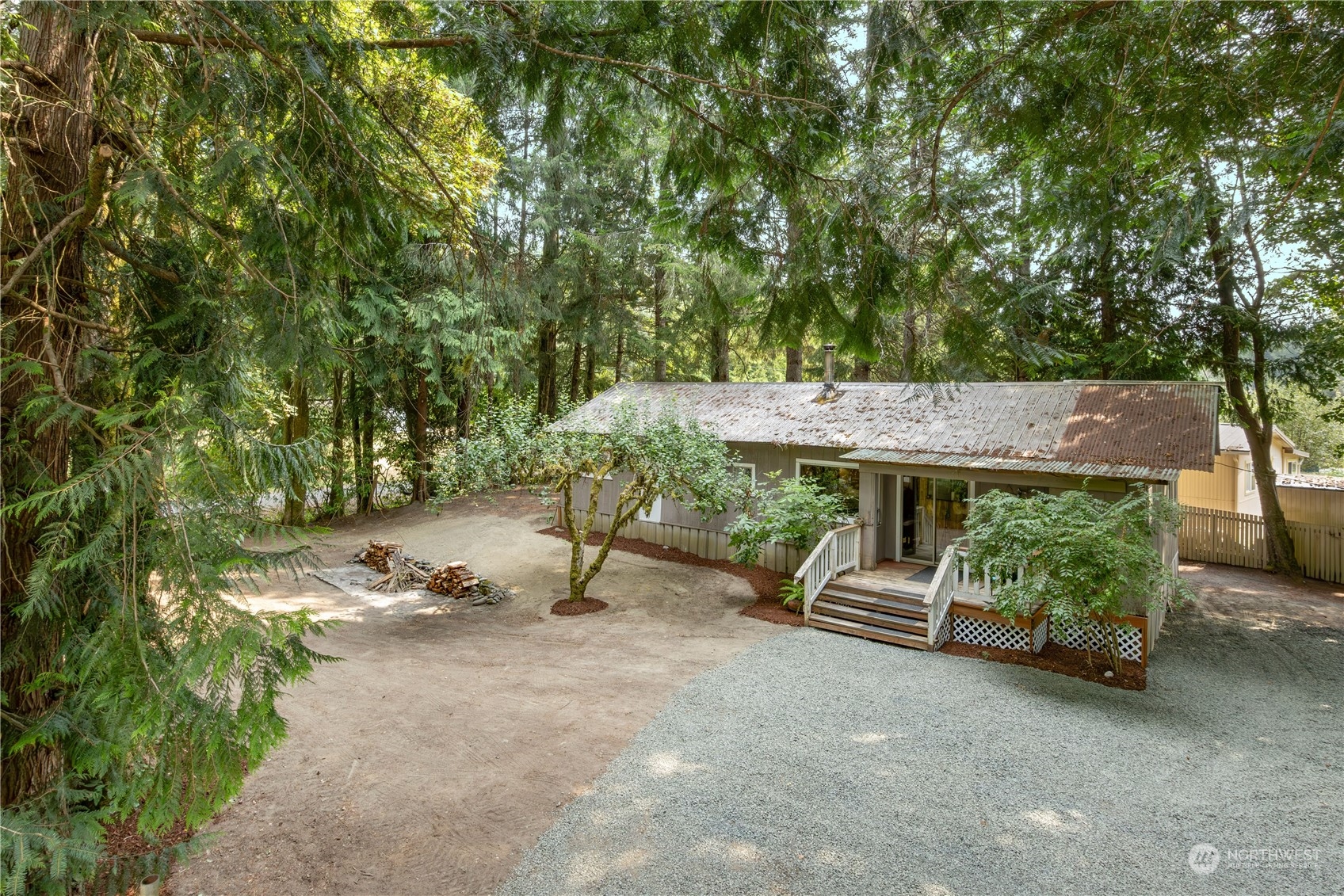 a view of backyard with a table and chairs