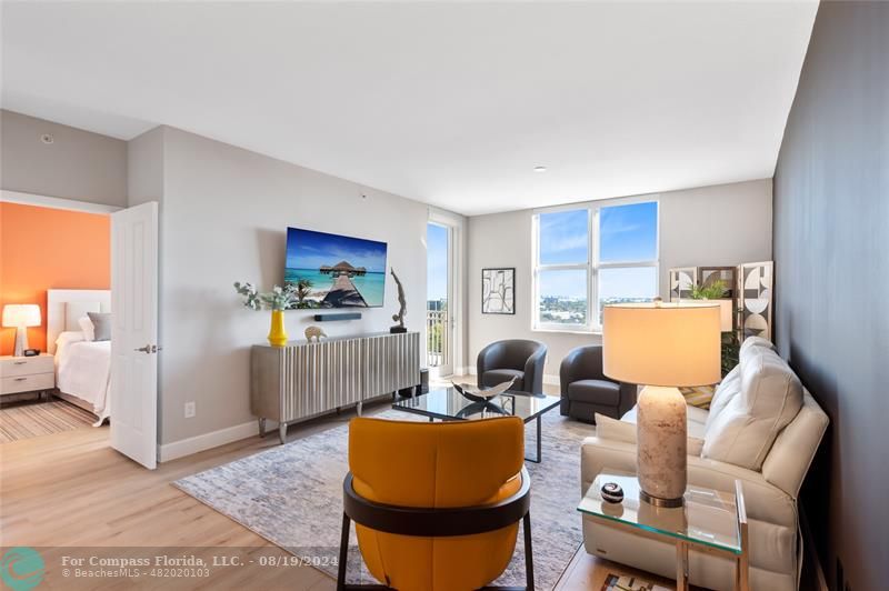 a living room with furniture and a rug