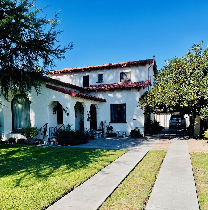 a front view of house with yard and green space