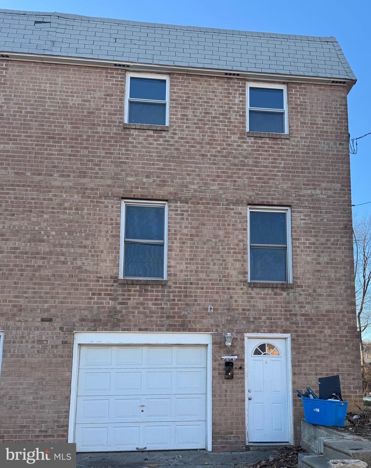 a brick building with four windows