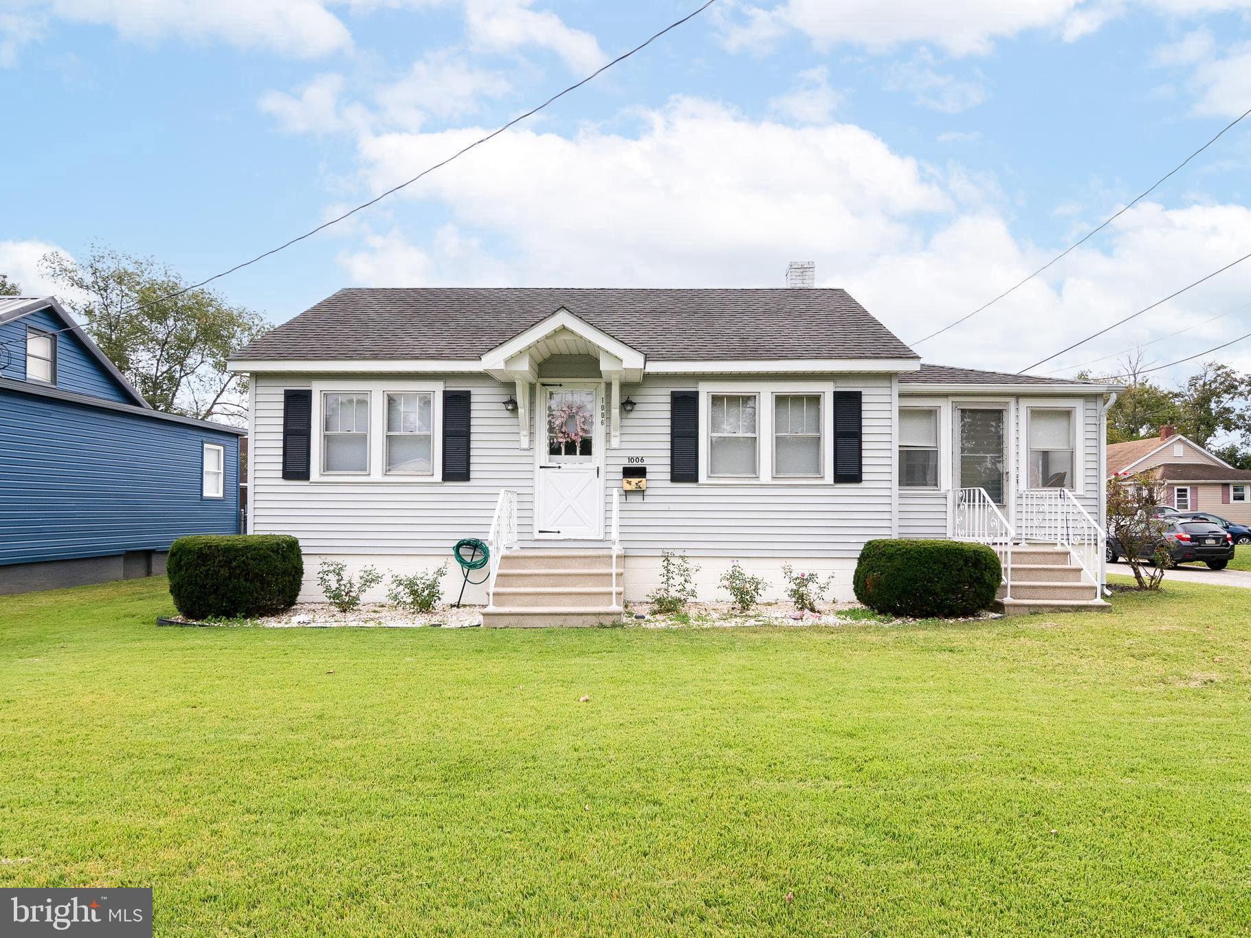 a front view of a house with yard and garage