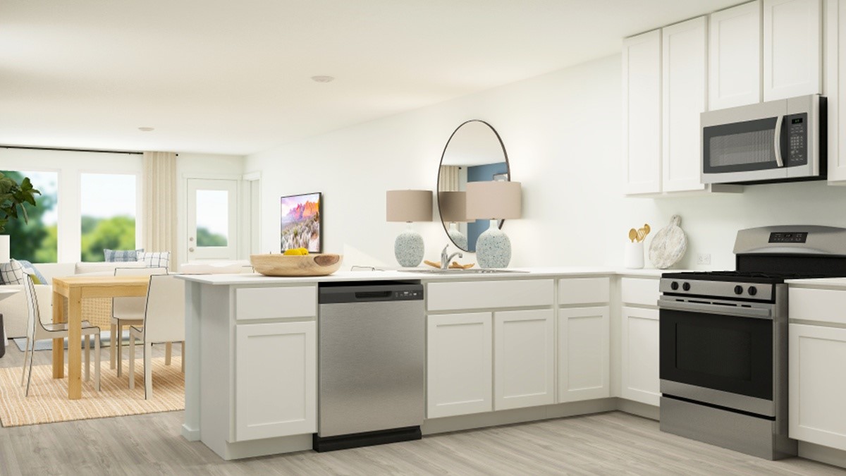 a kitchen with sink a microwave and cabinets