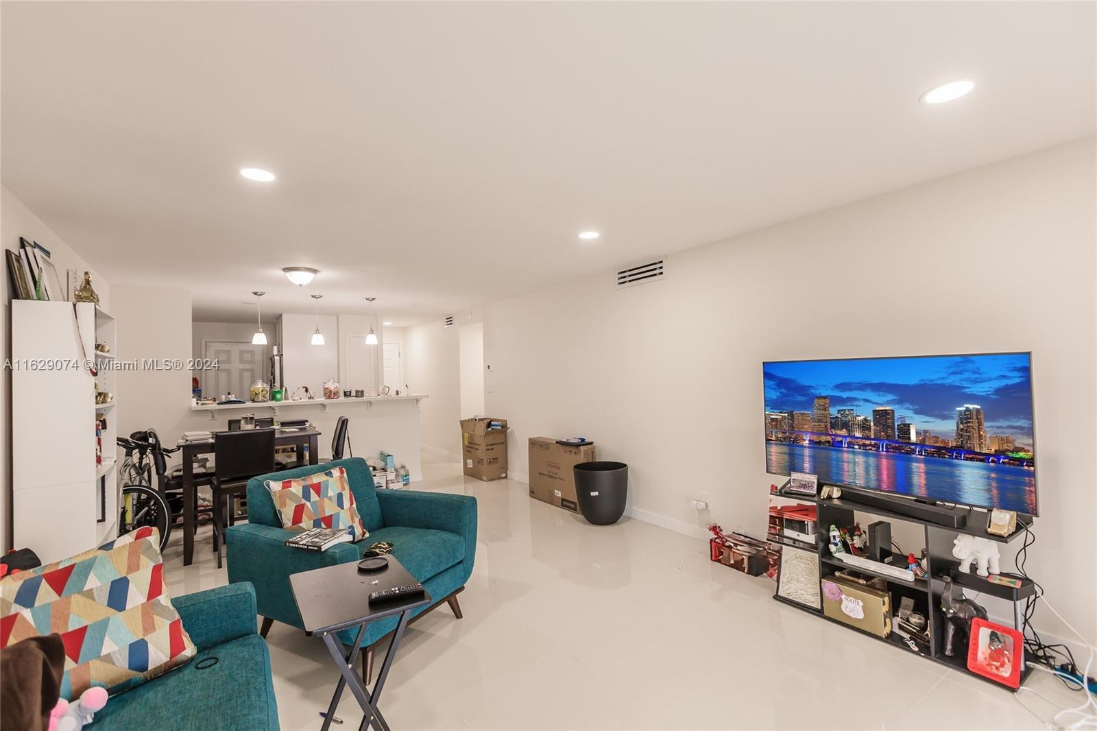 a living room with lots of furniture and a flat screen tv